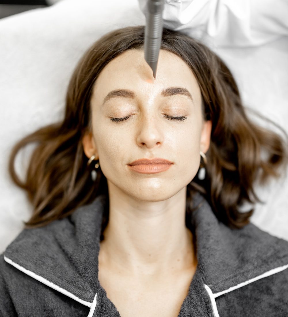cosmetologist-doing-laser-facelifting-procedure-in-beauty-clinic.jpg cosmetologist-doing-laser-facelifting-procedure-in-beauty-clinic.jpg